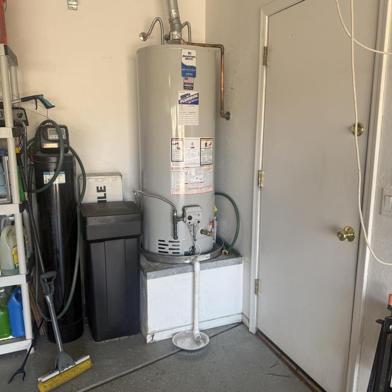 Water heater with new ventilation pipe in utility room
