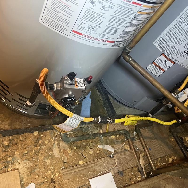 50-gallon gas water heater with yellow gas line
