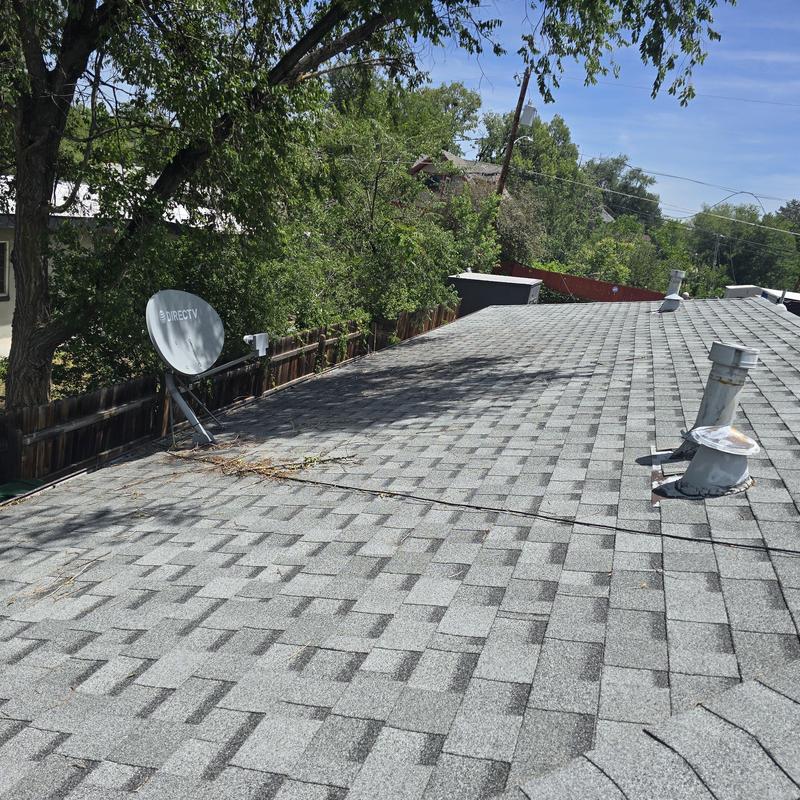 Asphalt shingle roof inspection with satellite dish and vents
