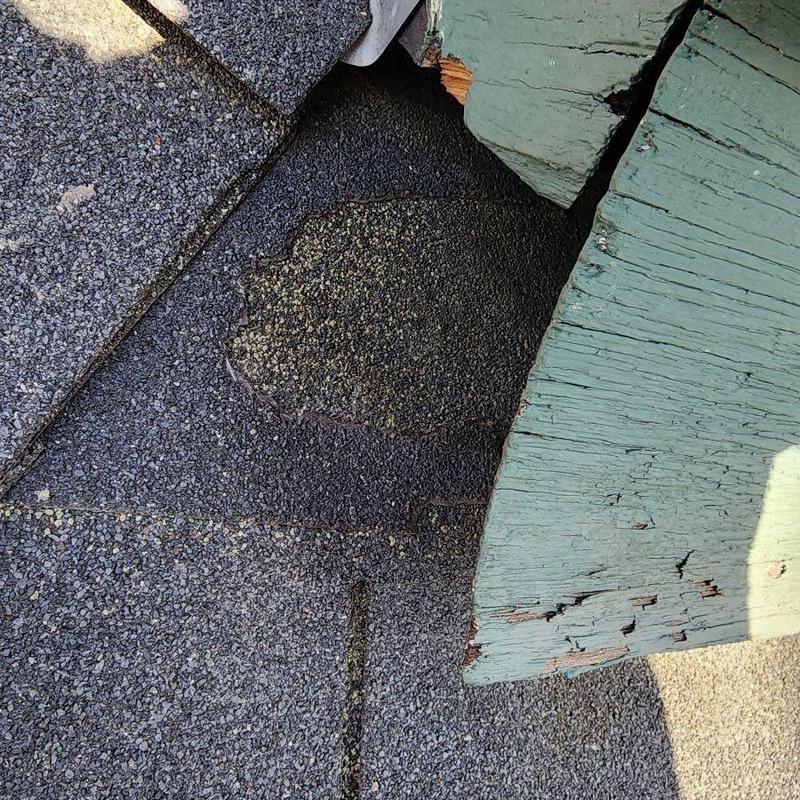 Roof shingles with damaged wood fascia board