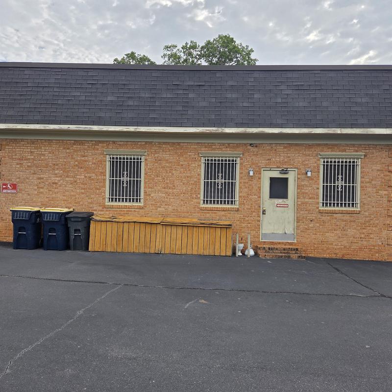 Mansard shingle roof on brick commercial building
