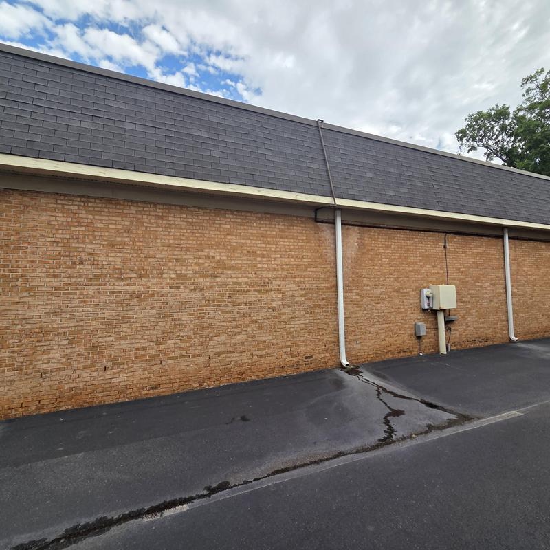 Mansard shingle roof with brick exterior wall