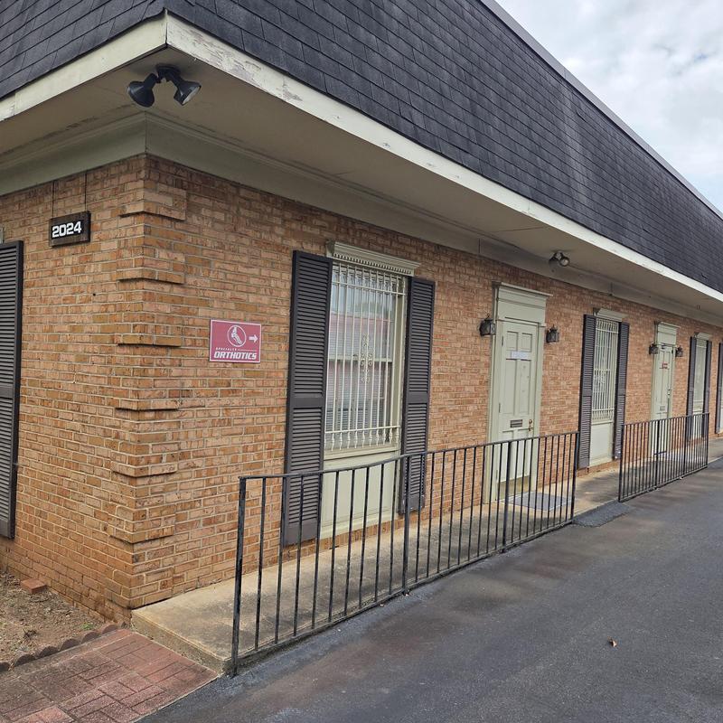 Mansard shingle roof on brick commercial building