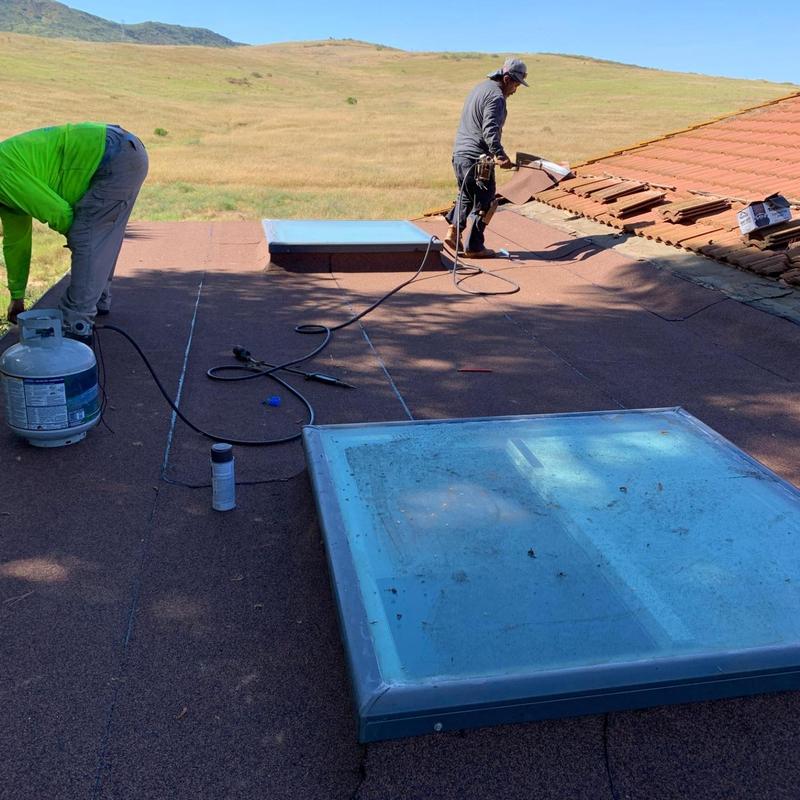 Torch down roofing system installation on flat roof Torch down roofing system installation on flat roof