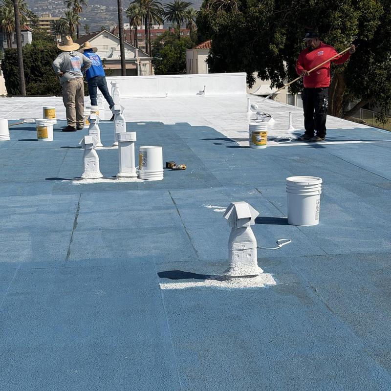 Silicone Roof Coating Application on Flat Roof Silicone Roof Coating Application on Flat Roof