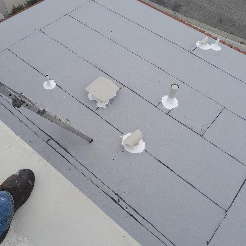 Flat roofing membrane with sealed pipe vents in West Covina Flat roofing membrane with sealed pipe vents in West Covina