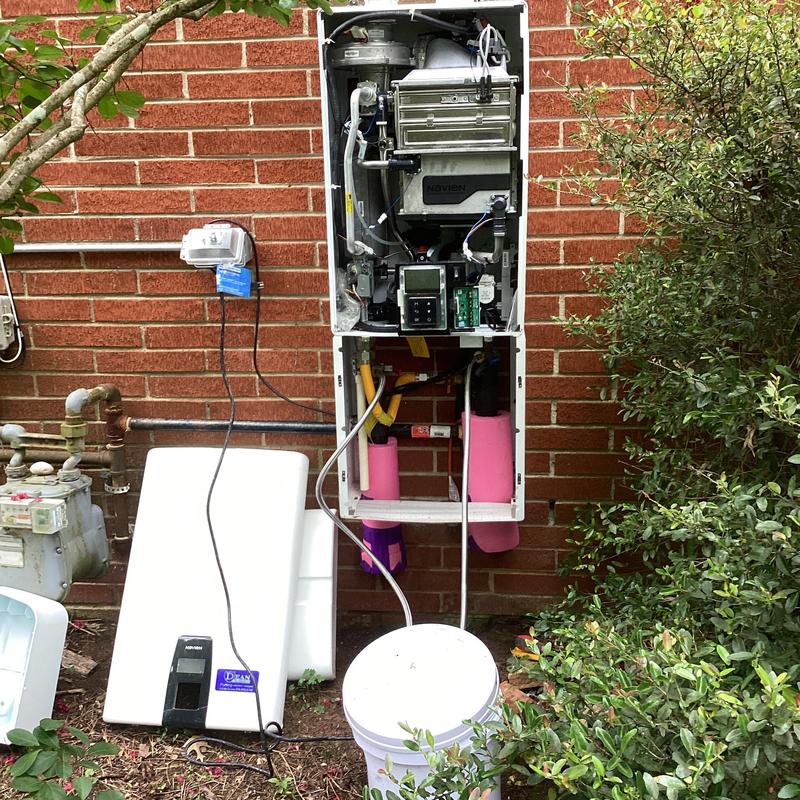 Navien water heater opened for yearly descaling and flush Navien water heater opened for yearly descaling and flush
