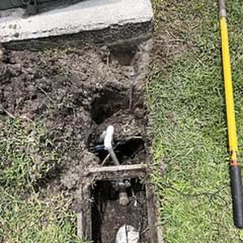 Main water service line excavation with PVC adapter installation