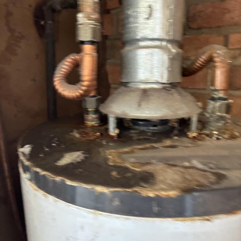 Water heater with corroded top and piping connections Water heater with corroded top and piping connections