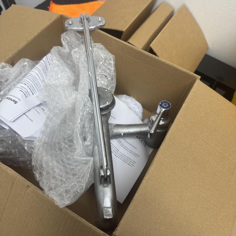 ADA Chicago style faucet in packaging with instructions