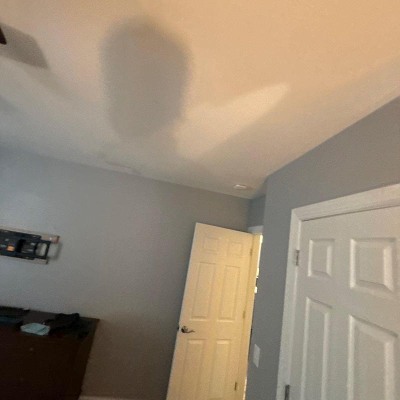 Ceiling water damage stain in residential room