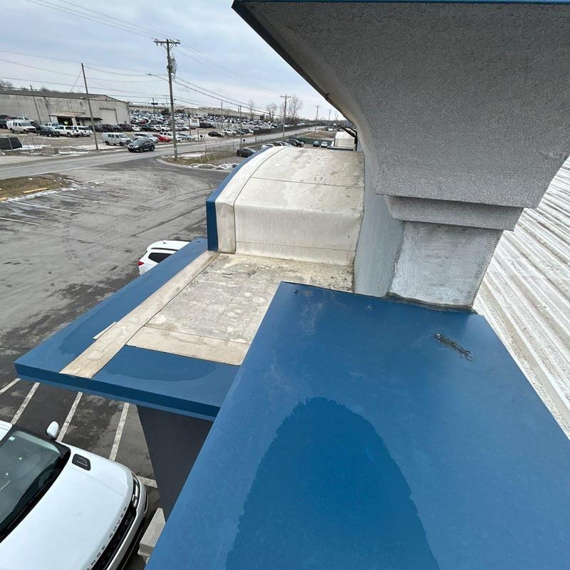Commercial roof edge with hail damage inspection