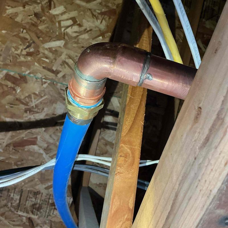 Copper pipe and PEX-B fitting near expansion tank