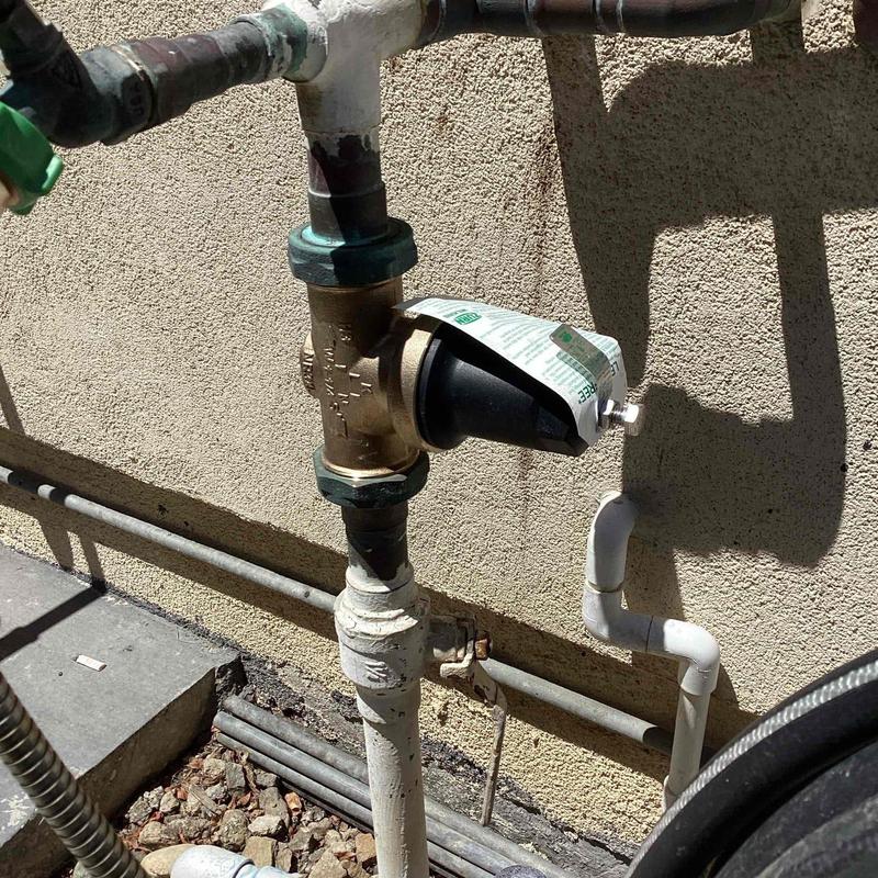 Pressure-reducing valve installed on outdoor plumbing pipe