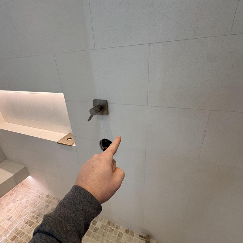 Shower valve installation with tiled wall in bathroom