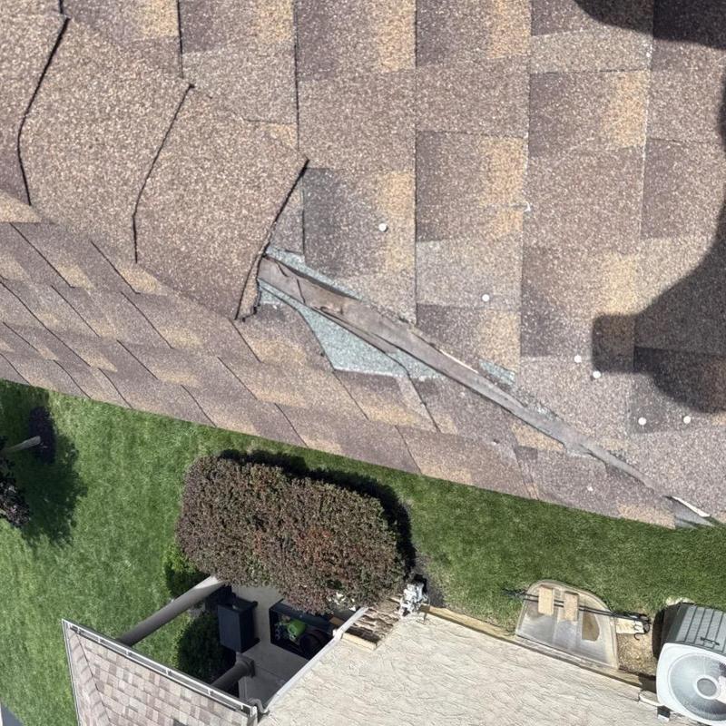 Ridge cap shingles missing on asphalt roof