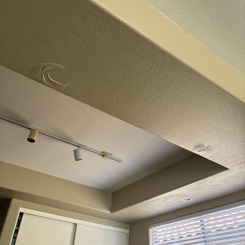 Drywall access hole cut in ceiling beam