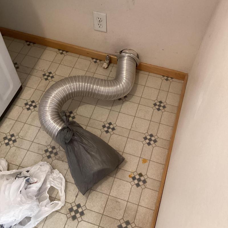 Dryer vent duct sealed with plastic bag in laundry area Dryer vent duct sealed with plastic bag in laundry area