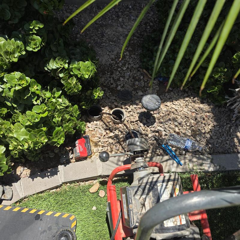 Sewer main yard clean-out with drain cleaning machine Sewer main yard clean-out with drain cleaning machine