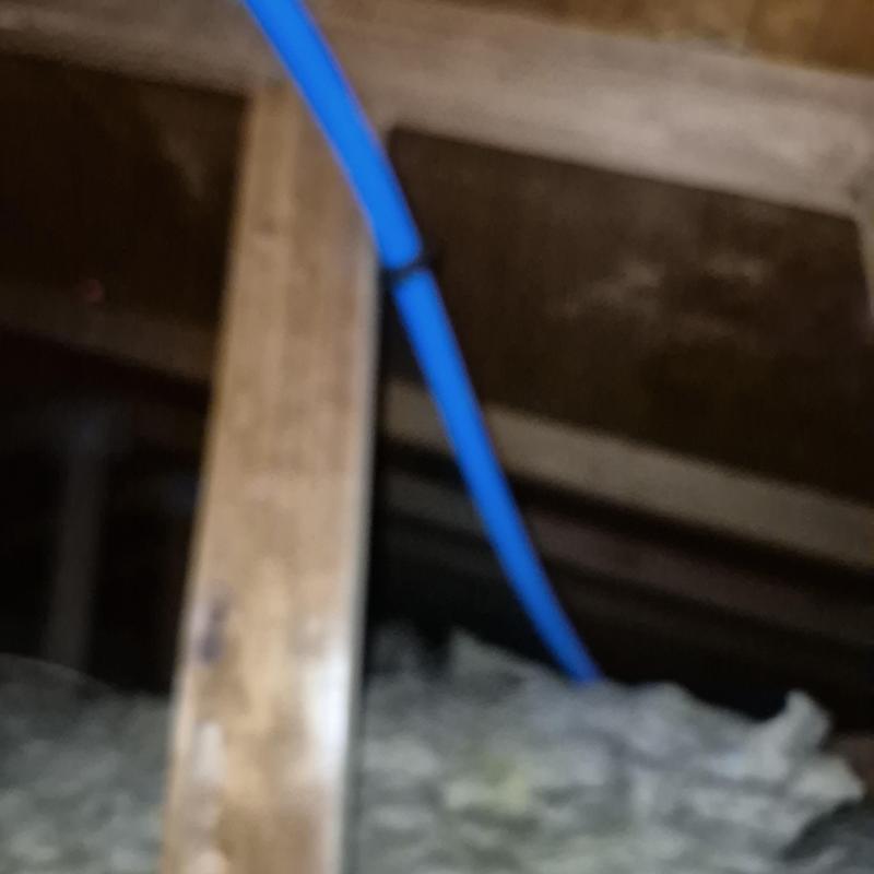 Pex water line running through attic insulation