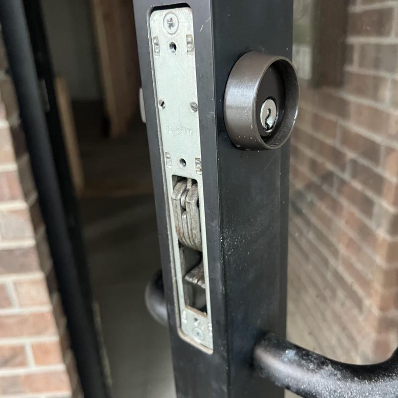 Metal mortise lock and cylinder on commercial door