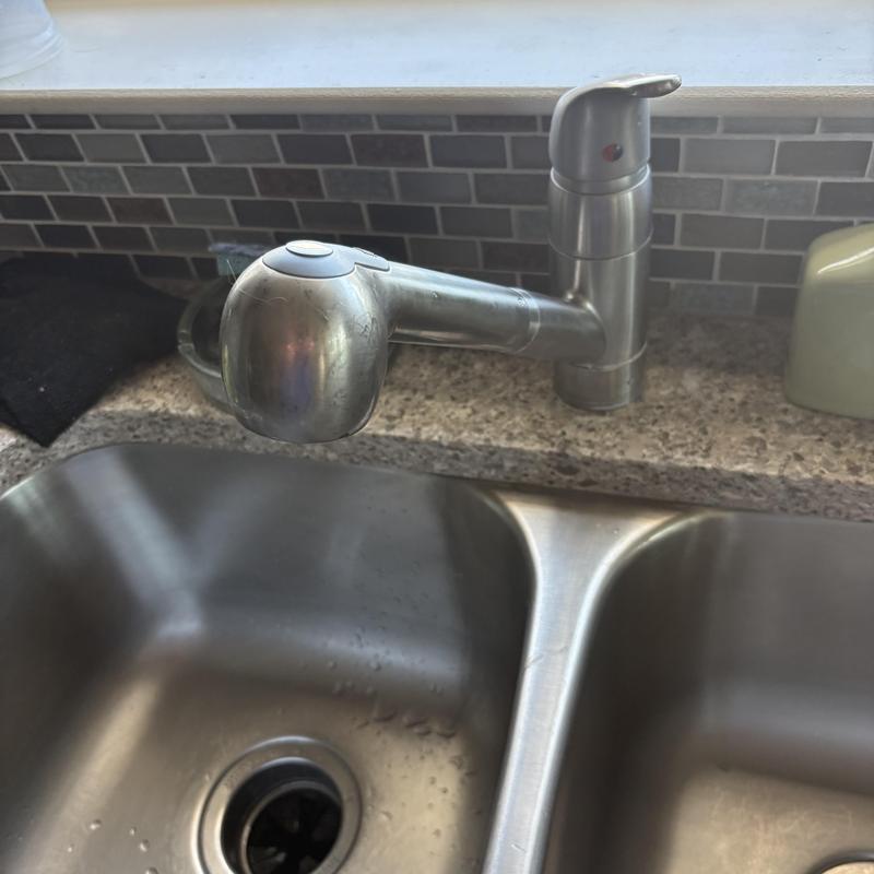 Kitchen faucet with pull-out sprayer on granite countertop Kitchen faucet with pull-out sprayer on granite countertop