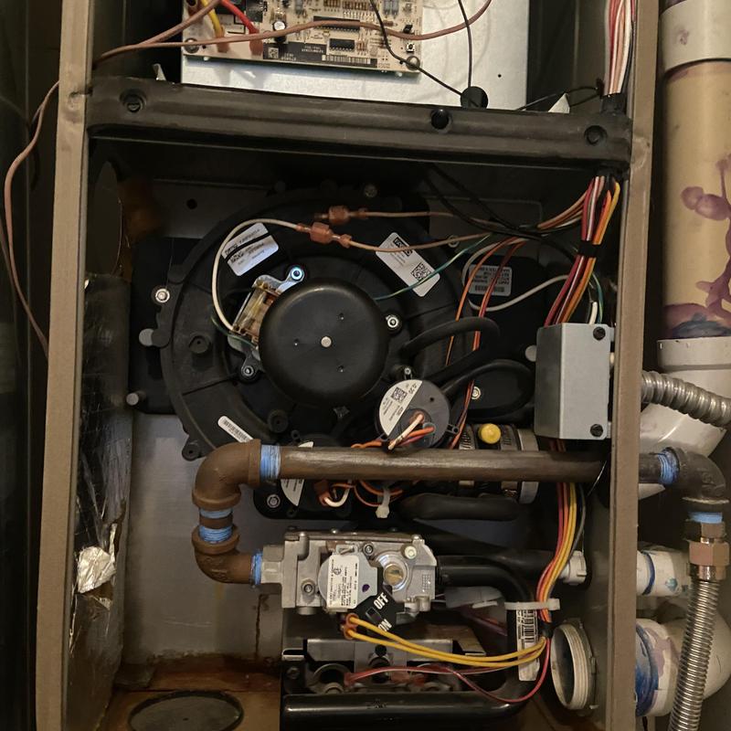 Furnace interior showing replaced components and wiring
