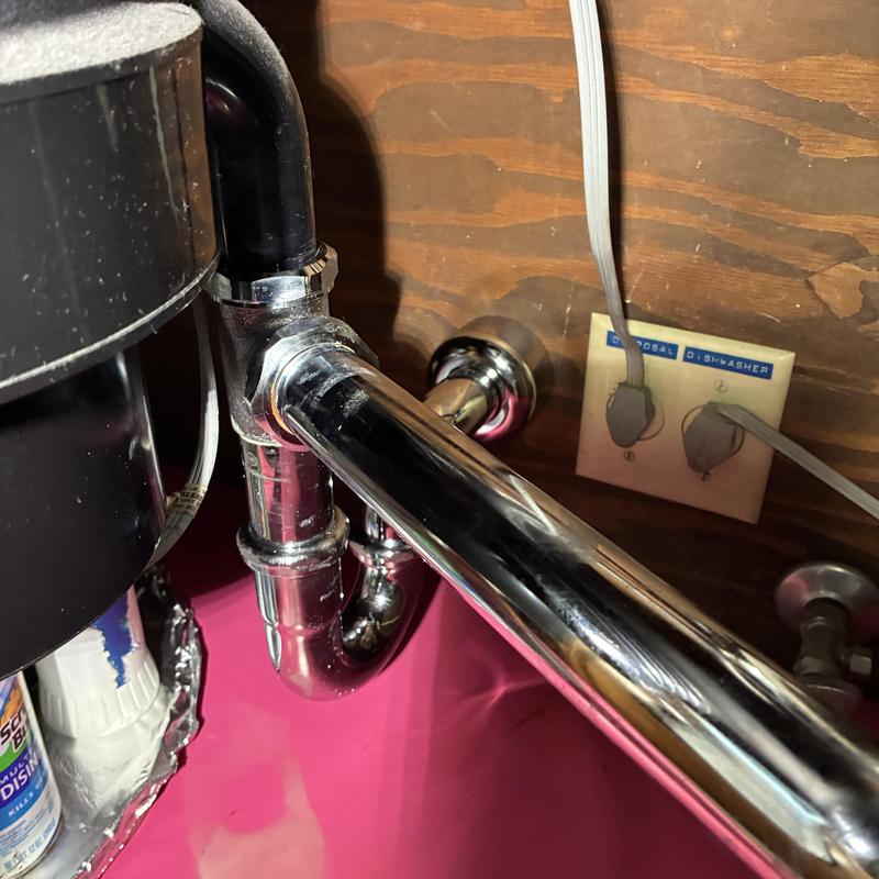P-trap and drain pipes under kitchen sink