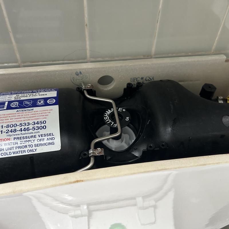 Toilet flush valve assembly with new cartridge installed