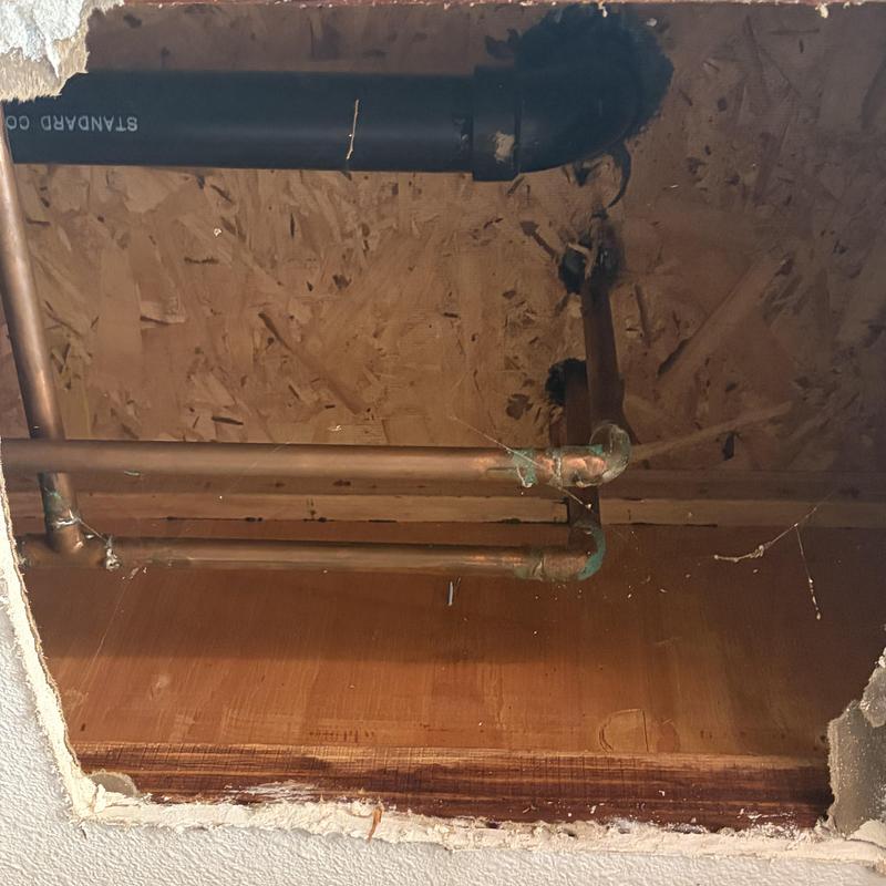 Shower cartridge leak behind ceiling drywall opening