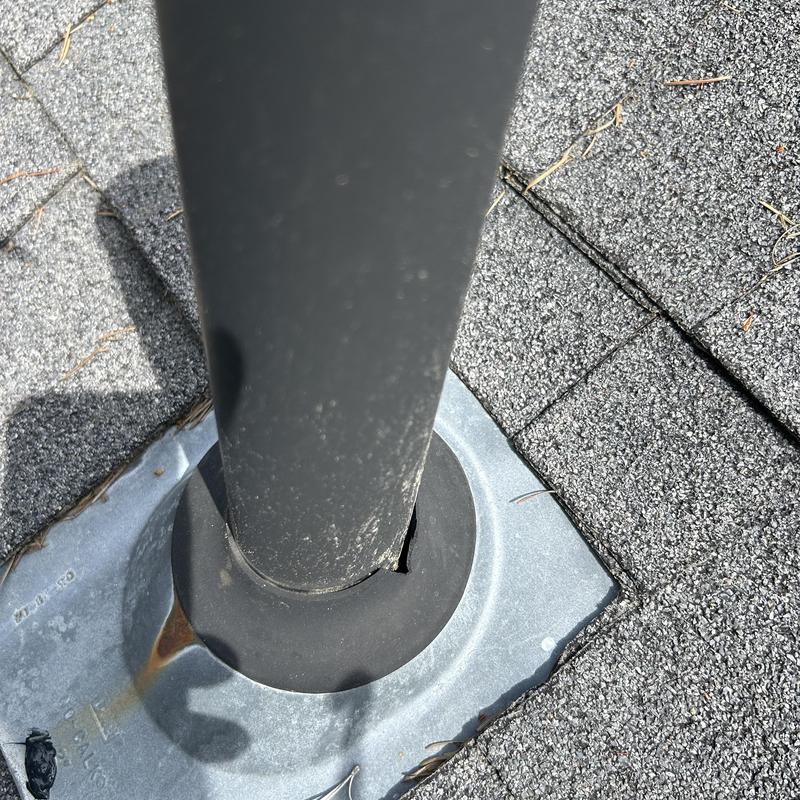 Roof vent pipe flashing with damaged seal on shingles Roof vent pipe flashing with damaged seal on shingles