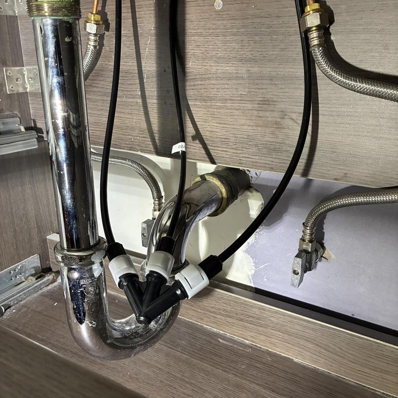 Bathroom sink P-trap with braided supply lines installed