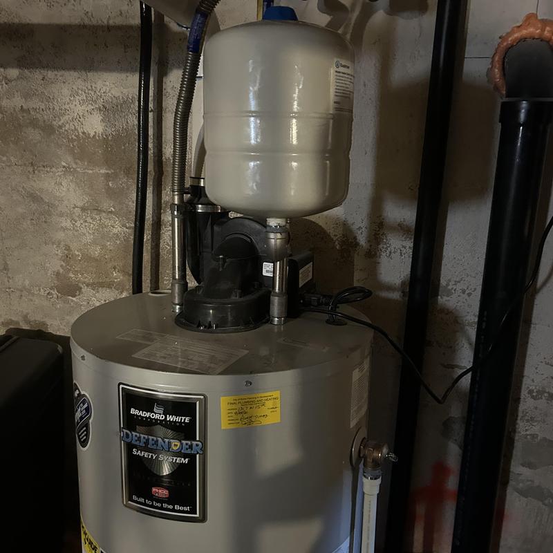 Expansion tank and water heater setup in basement