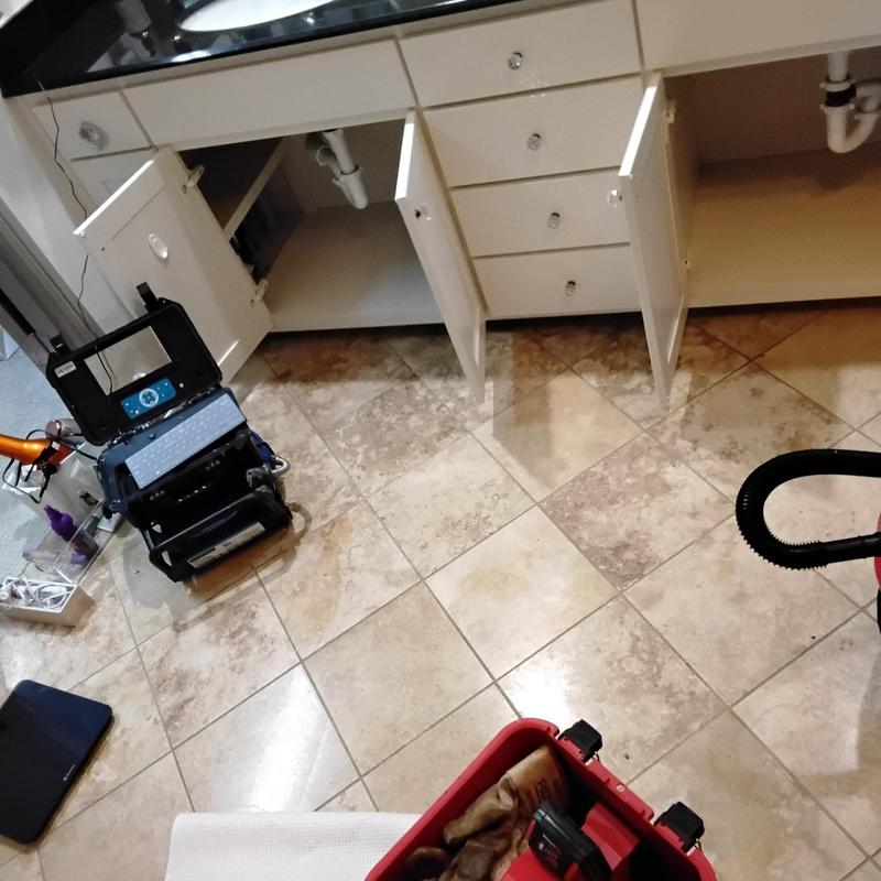 Bathroom drain inspection camera and plumbing access setup
