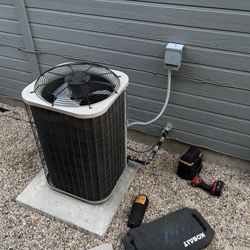 Air conditioner outdoor unit with new run capacitor installed Air conditioner outdoor unit with new run capacitor installed