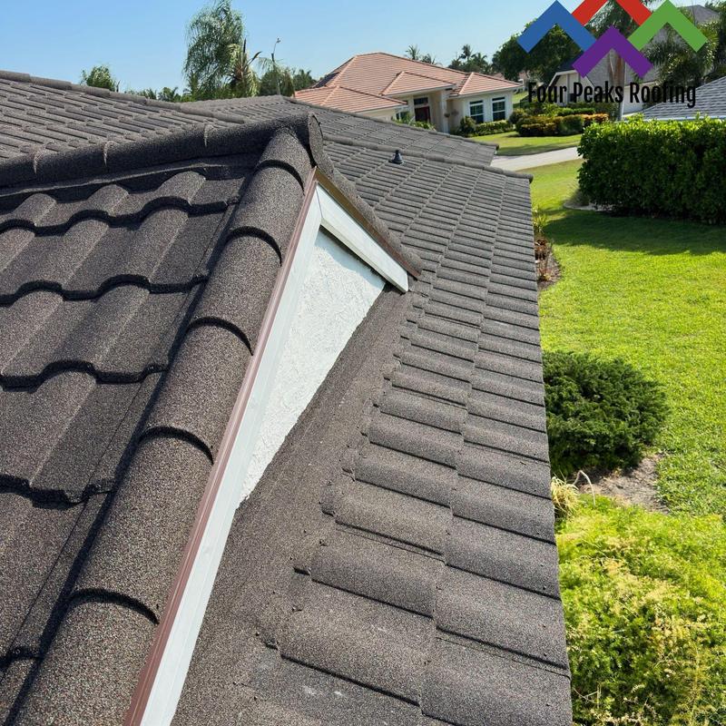 Stone-coated steel roof with ridge cap and dormer Stone-coated steel roof with ridge cap and dormer
