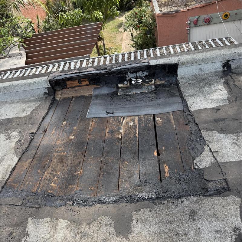 Flat roof wood deck patch with waterproofing membrane Flat roof wood deck patch with waterproofing membrane