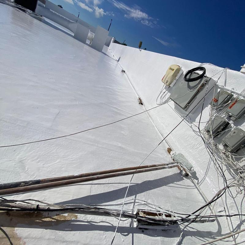 Silicone-coated flat roof with electrical wiring Silicone-coated flat roof with electrical wiring