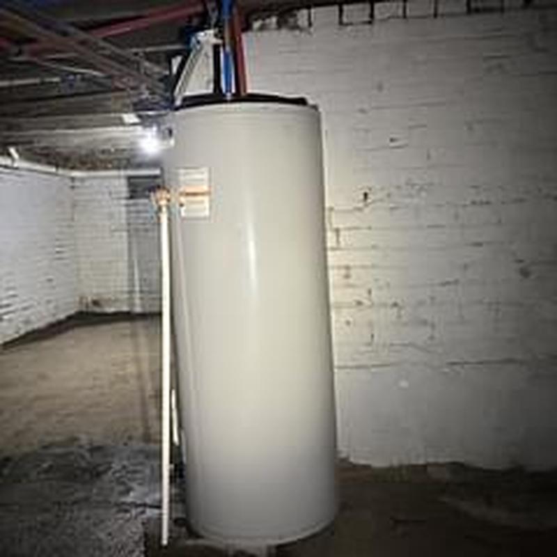 Water heater tank with flush and element replacements