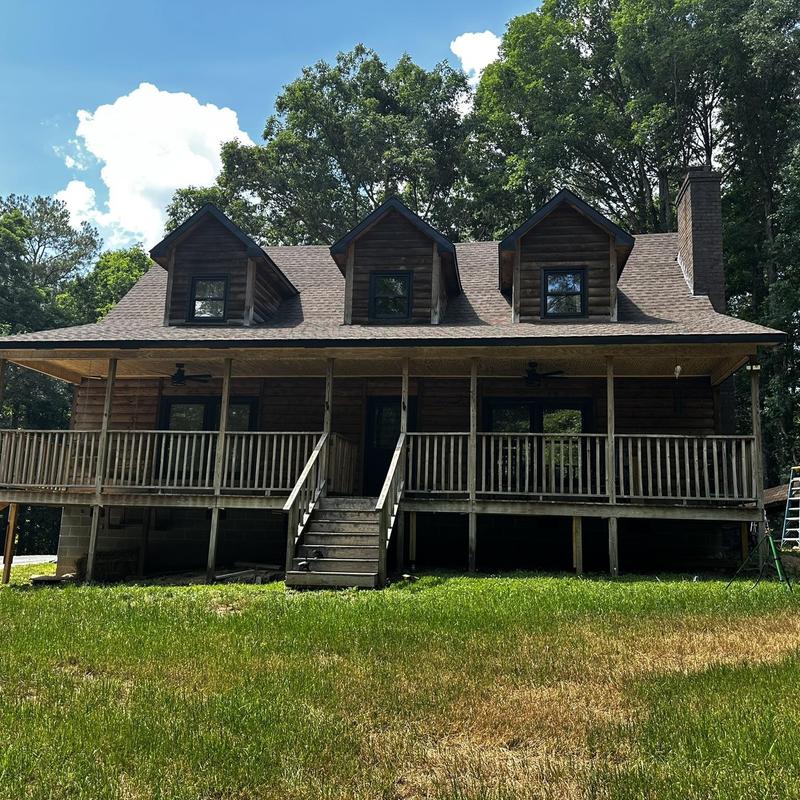 Wooden porch structure with steps and railing
