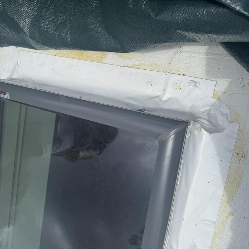 TPO roofing around skylight patch on flat roof