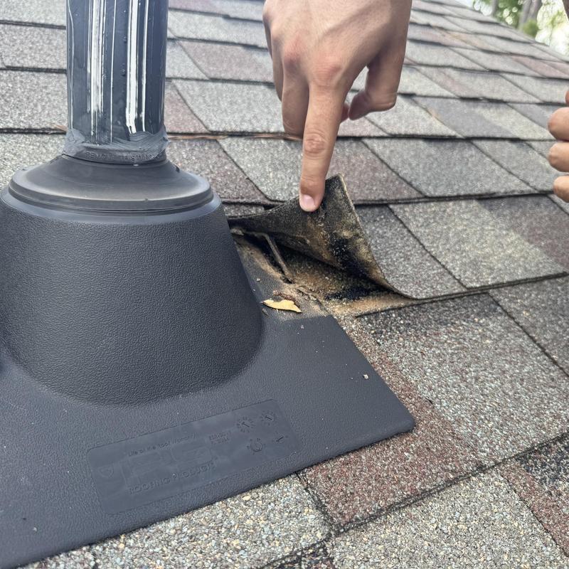 Roof vent flashing with lifted asphalt shingle repair