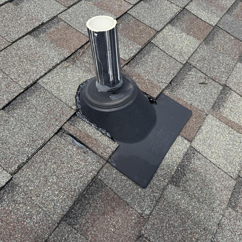 Roof vent flashing on asphalt shingle roof repair