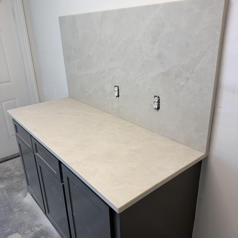 Granite countertop and backsplash on bathroom vanity