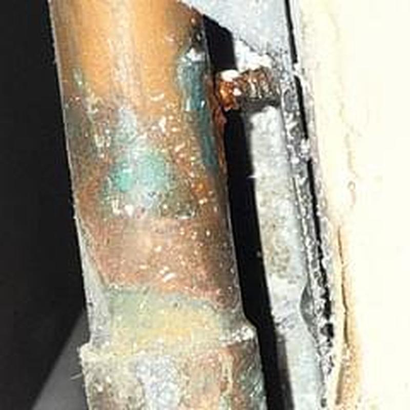 Copper water pipe with screw puncture and corrosion
