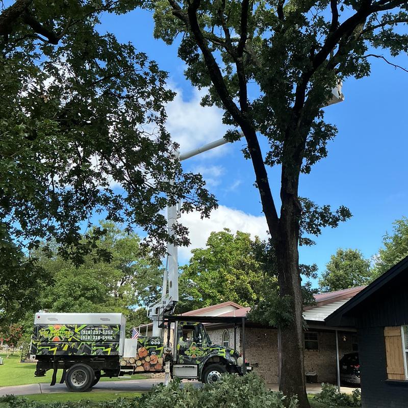 Storm-damaged tree removal with bucket truck near home Storm-damaged tree removal with bucket truck near home