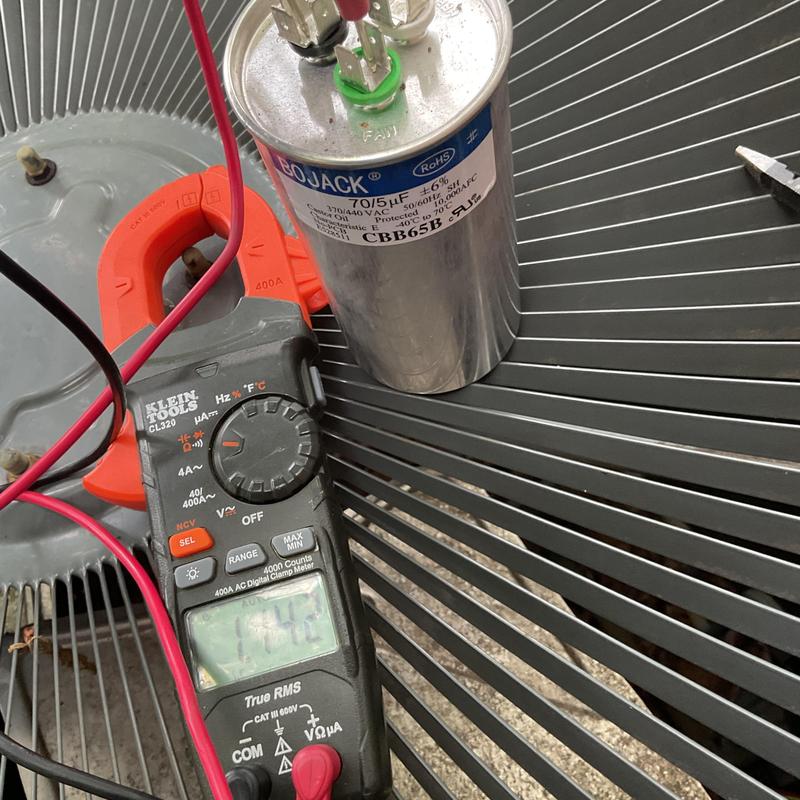 Dual run capacitor and clamp meter on AC fan coil unit