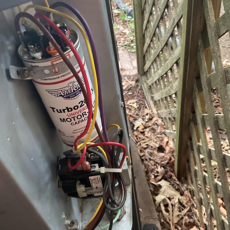 Dual run motor capacitor with wiring inside HVAC unit