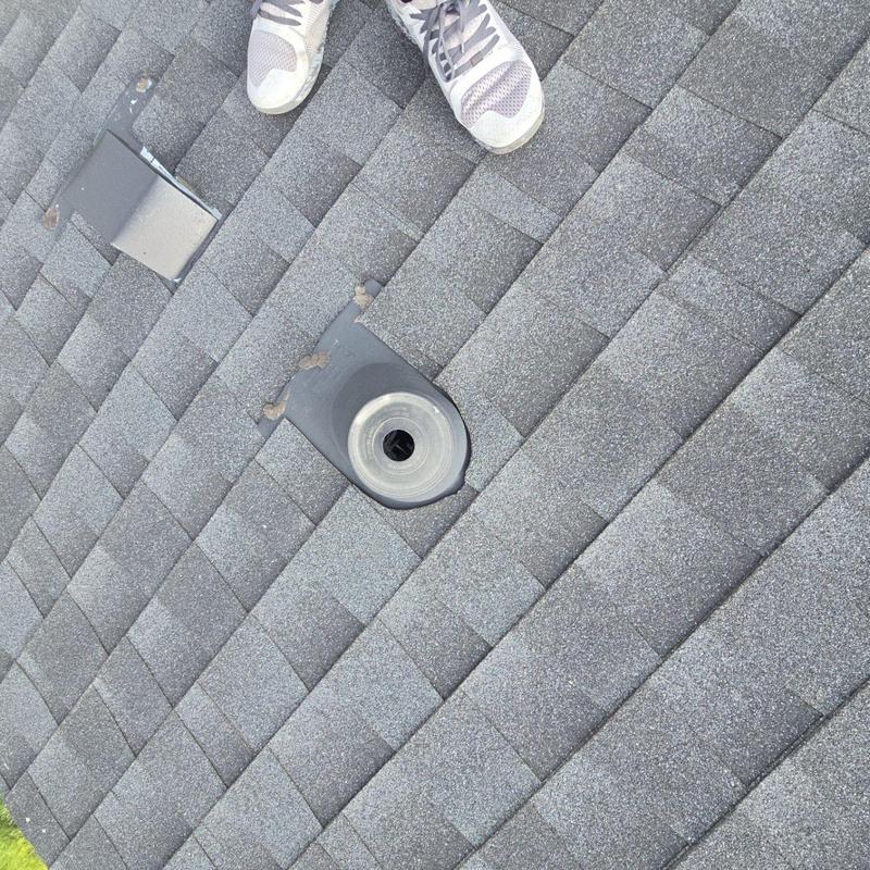 Pipe jack on shingle roof with missing pipe section