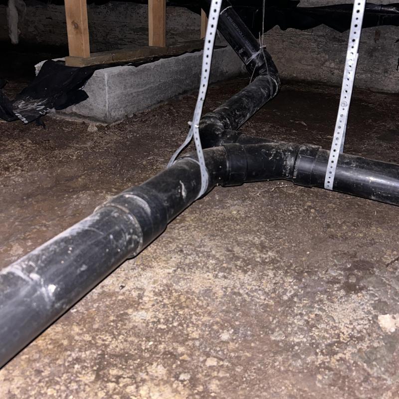 Foundation drainage pipes installed in crawl space